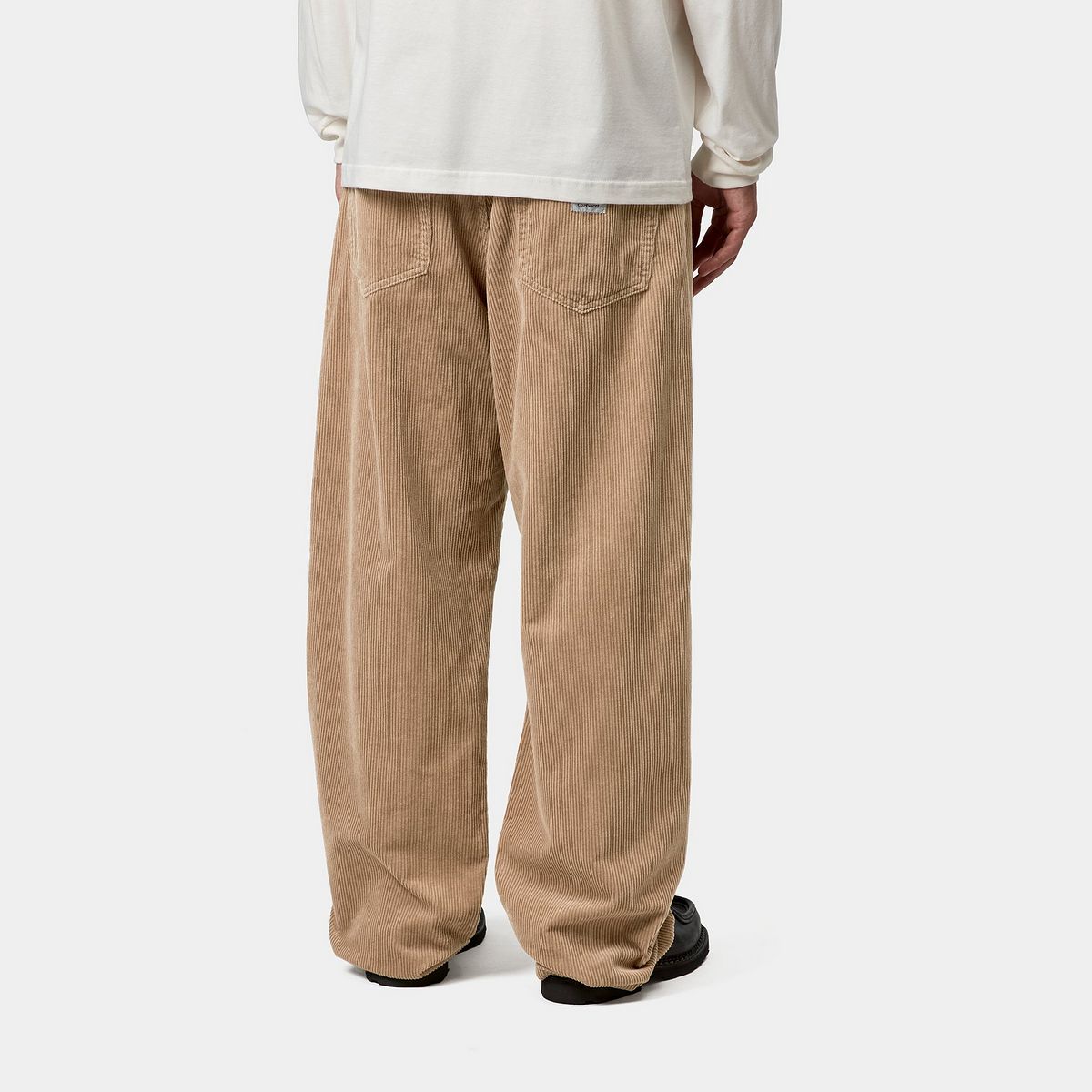 which is a midweight cotton fabric with thick ridges. It is cut in a loose tapered fit with a regular waist